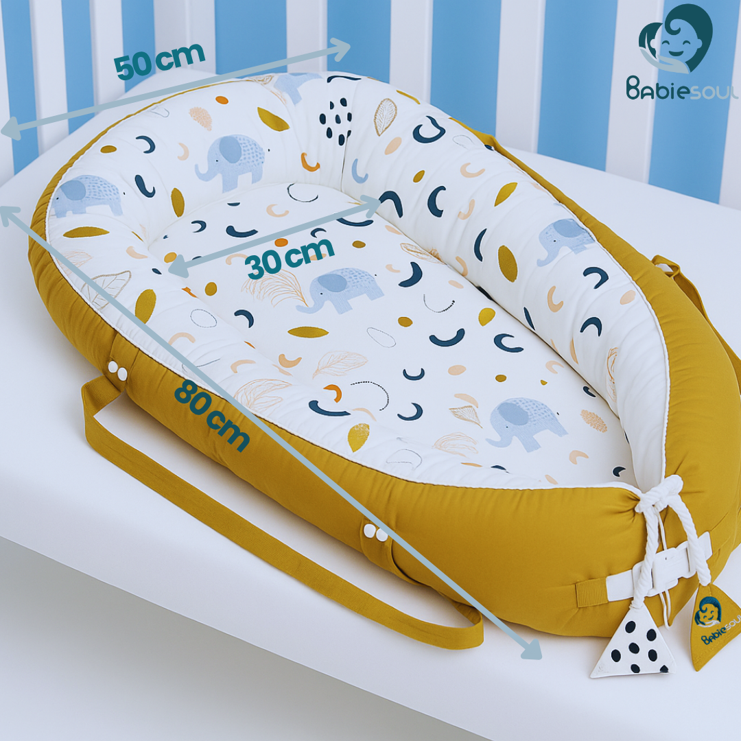Babiesoul baby nest sleep pod in mustard with elephant pattern and adjustable straps